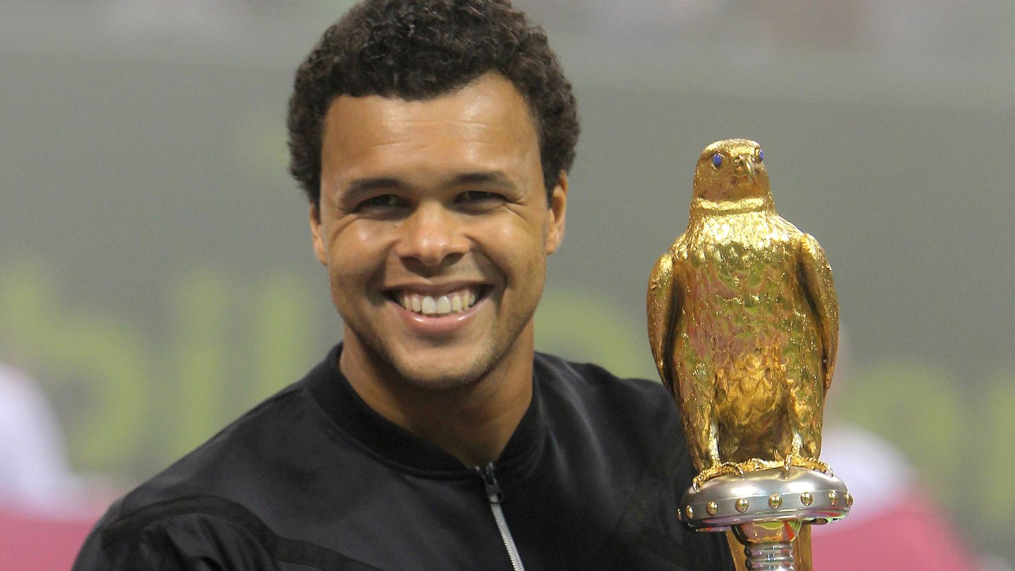 French tennis star Jo-Wilfried Tsonga was all smiles after winning his eighth ATP Tour title in Doha on Saturday.