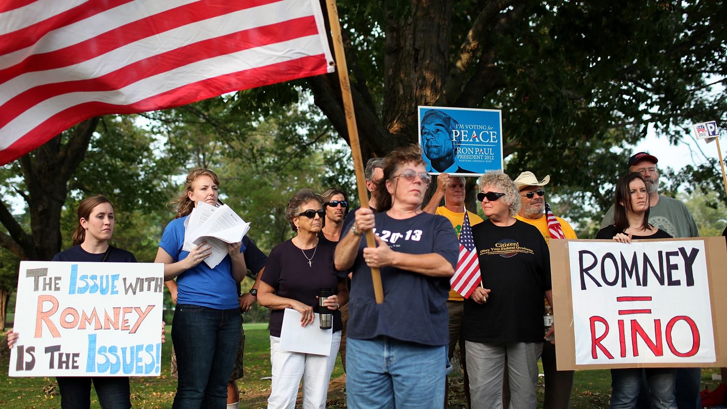 Members of the New Hampshire Tea Party protest against  Mitt Romney before a rally on September 4, 2011.