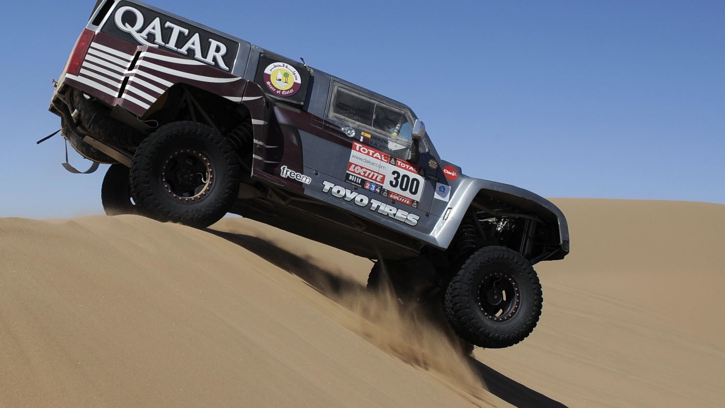 Qatari driver Nasser Al-Attiyah steers his Hummer through dunes during the seventh stage in Copiapo on Saturday.
