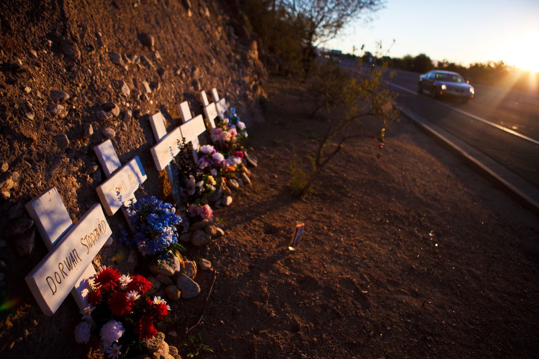 A memorial rests on a highway for six people who lost their lives in a shooting last year in Tucson, Arizona.