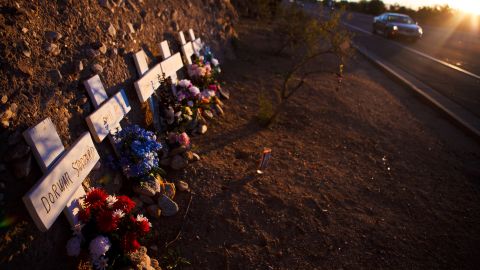 A memorial rests on a highway for six people who lost their lives in a shooting last year in Tucson, Arizona.