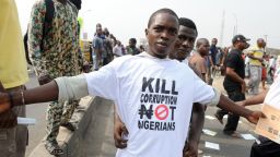 A protester sports a an anti-corruption T-shirt  in 2012 in Lagos. Femi Kuti says it's time for world leaders to join the fight.