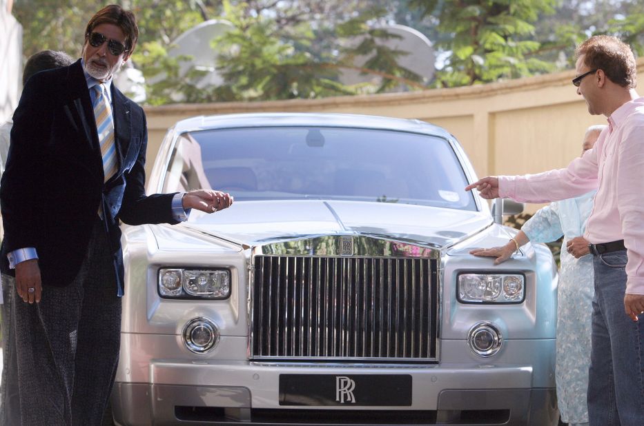 Bollywood actor Amitabh Bachchan, left, and director Vidhu Vinod Chopra pose with a Rolls-Royce Phantom in Mumbai in February 2007.