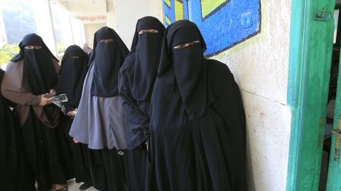 Egyptian women waiting to vote at a polling station near Cairo on January 4.