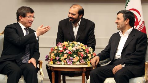 Turkish Foreign Minister Ahmet Davutoglu, left,  meets with Iran's President Ahmadinejad, right, in Tehran on January 5.