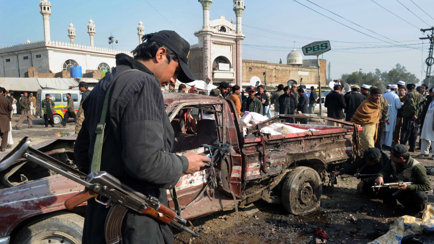 Pakistani security personnel examine the site of a bomb blast in the Jamrud Market in the Khyber Agency on January 10, 2012.