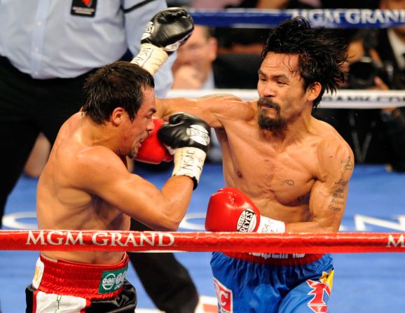 Manny Pacquiao (right) retained his WBO world welterweight title against Juan Manuel Marquez in Las Vegas, Nevada in November 2011. In May 2010, he was elected as a Sarangani representative in the Filipino Congress.