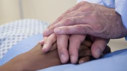 hospital comfort holding hands patient