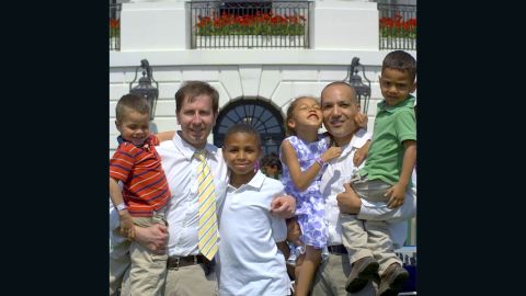 Frederic Deloizy, left, and Mark Himes, with their four children in April 2010.