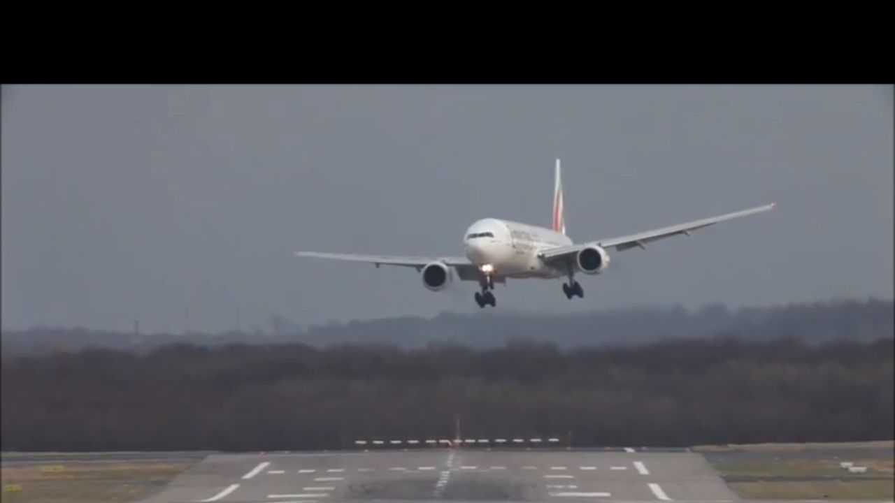 Planes landing at Düsseldorf International Airport cope with crosswinds during a storm. 
