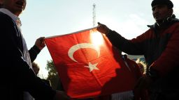 Demonstrators hold a Turkish flag during a protesta gainst an attack on Turkish troops (File picture 2011)