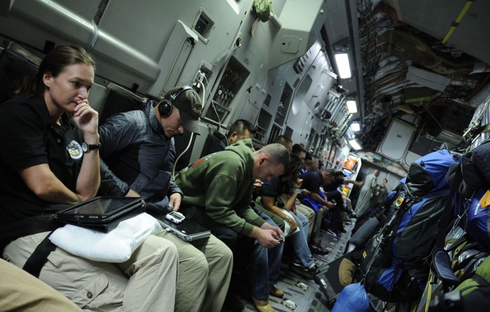 JPAC team members on a U.S. Air Force C-17 aircraft enroute to a recovery operation in Vietnam. They travel the world looking for the remains of service personnel killed in U.S. military action.
