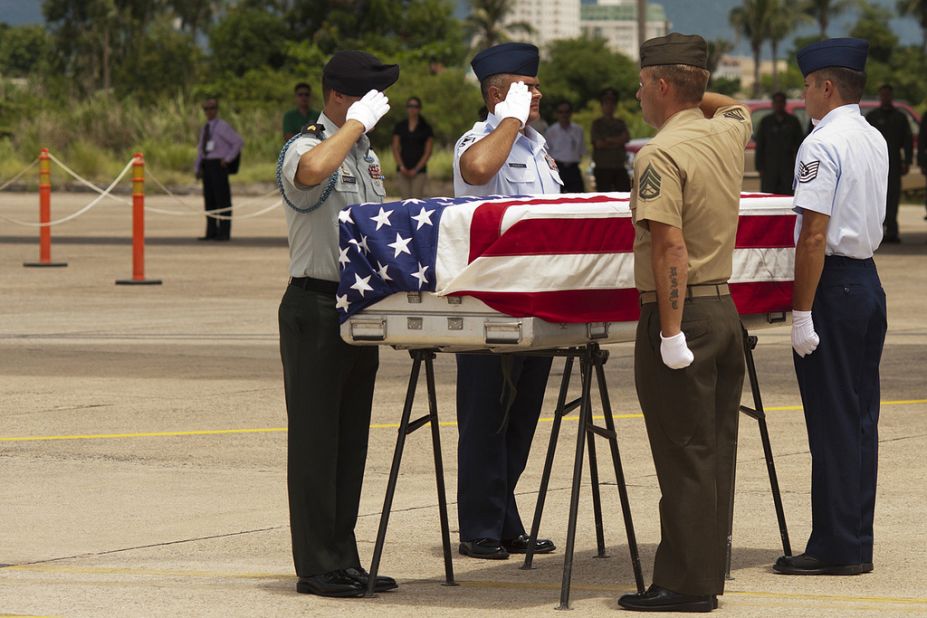 A U.S. military detail from JPAC honors the sacrifice made by Americans during a repatriation ceremony at Da Nang International Airport, Vietnam, before the body is flown home.