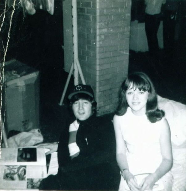 iReporter Lynn Kordus said her most memorable "Kodak moment" was with the Beatles in 1965. Here she poses with John Lennon while he thumbs through a magazine. <a href="http://ireport.cnn.com/topics/726798">See more Kodak moments on CNN iReport.</a>