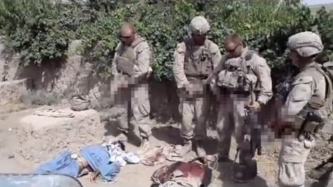 A still from a video purporting to show U.S. Marines urinating on dead Taliban fighters.