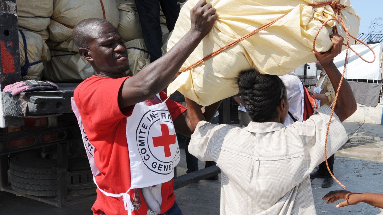 A Red Cross worker helps distribute supplies in Port-au-Prince, Haiti, in 2010. 