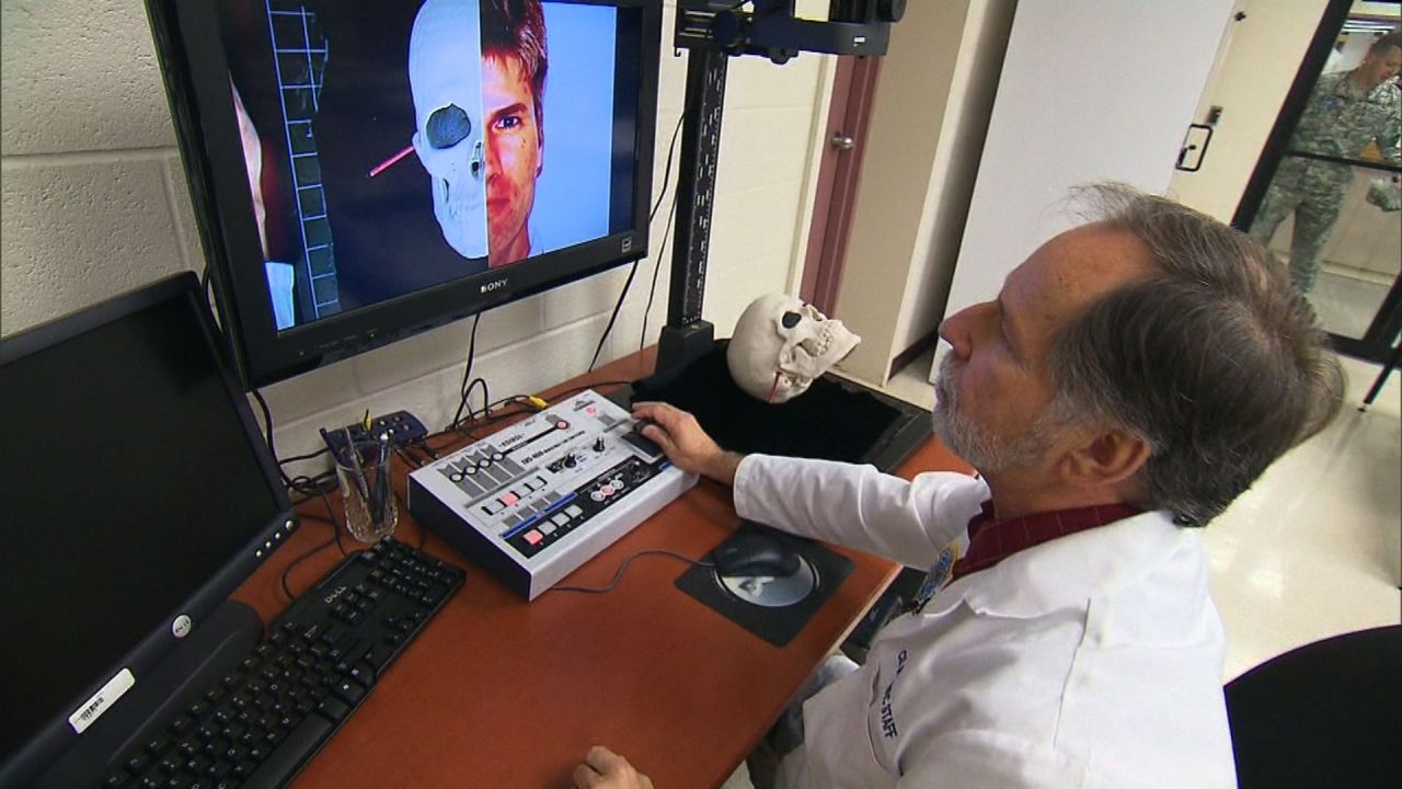 Forensic Science Academy Director Dr. Robert Mann tests technology that compares a photo with a skull to see if it can accurately identify the remains of U.S. service personnel.