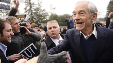 Republican presidential hopeful Ron Paul greets supporters outside a polling station in Manchester, New Hampshire.