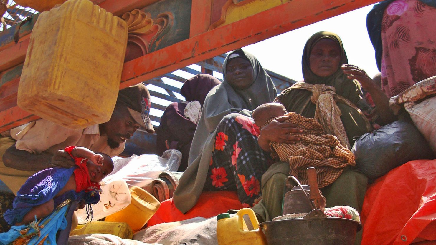 Somalis displaced by famine sit in the back of a truck ready to leave an internally displaced persons camp in Mogadishu Sunday.