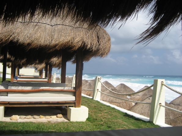 Donna Panabaker captured this view from a palapa in Cancun. "If there's something more relaxing than lounging in a shaded, comfy bed while overlooking a beautiful beach like this one, I don't know what it is!"
