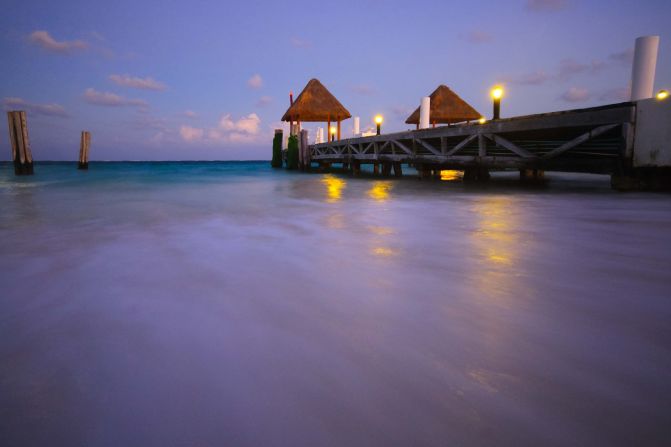 Steven O'Brien captured this breathtaking perspective. "As the sun started setting of this pier on the Riviera Maya, the moon was high and cast a wonderful light on the water."