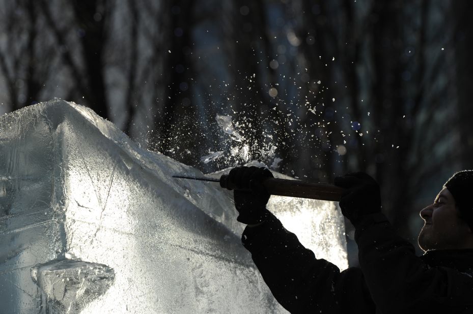 A sculptor works on a block of ice during the London Ice Sculpting Festival in Canary Wharf, east London, on January 13.