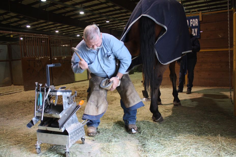 Del Slaugh puts a new set of horseshoes on a horse named West Indies. Slaugh has been a farrier for 43 years.   