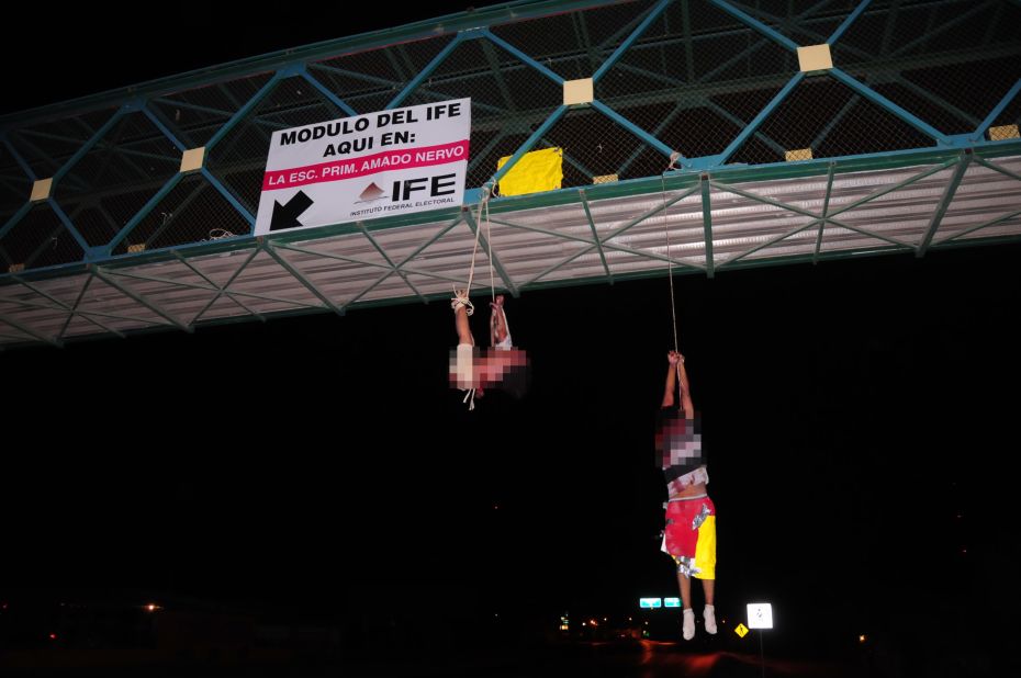 Two bodies hang from a bridge in Mexico in September 2011. Some cartels have developed reputations for sickening brutality -- seeming to kill for pleasure, just because they can.