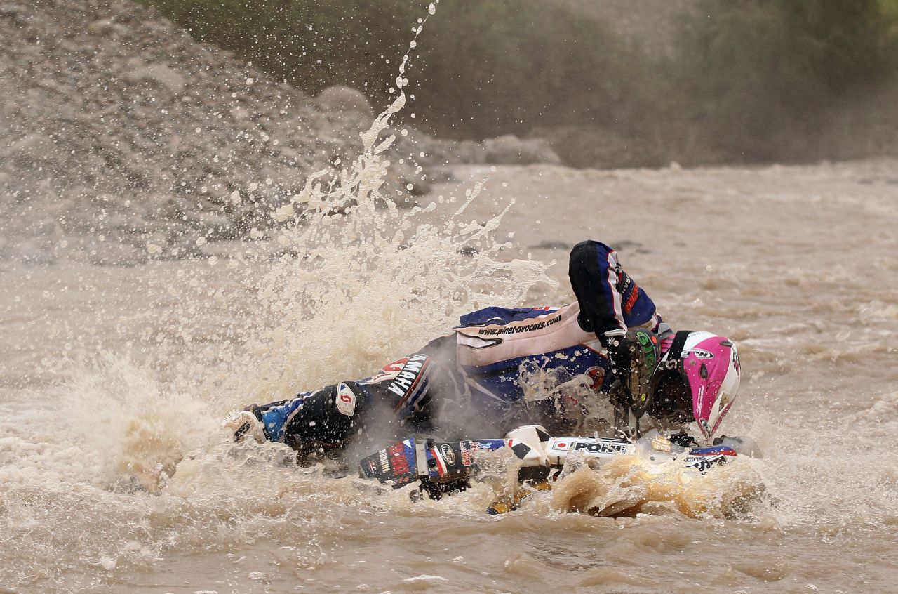 The Dakar tests racers both physically and mentally as they take on a variety of challenging terrains. This picture shows Yamaha rider David Barrot falling into a river in Peru during the 11th stage in 2012. 