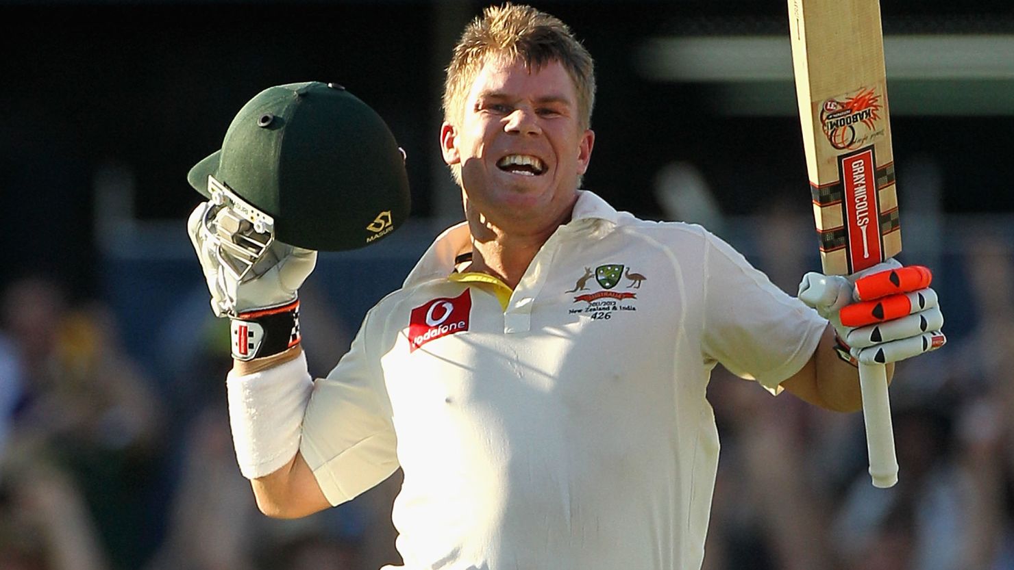 Australia batsman David Warner celebrates his century on the opening day of the third Test in Perth.