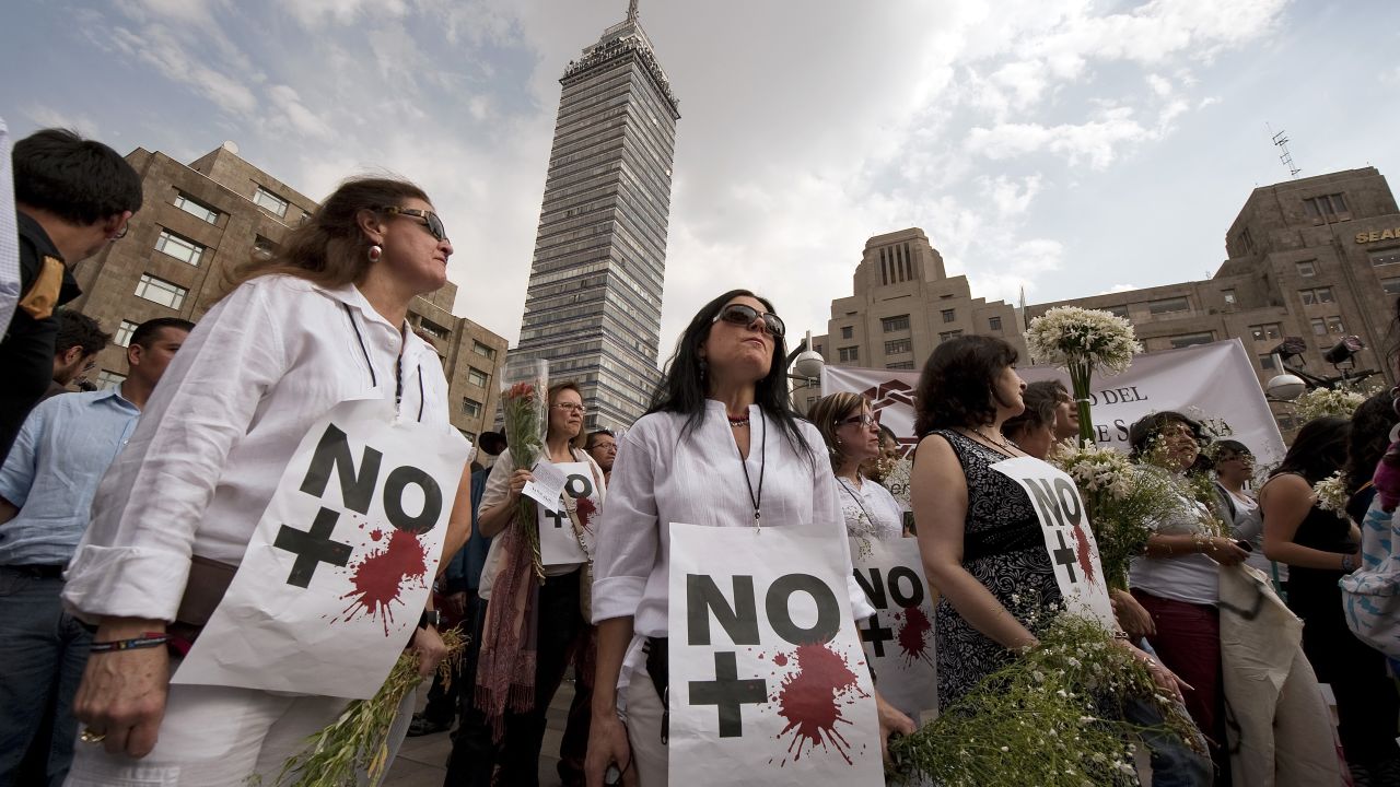 Anti-violence activists protest in Mexico City in April 2011. Their signs read, "No more blood."