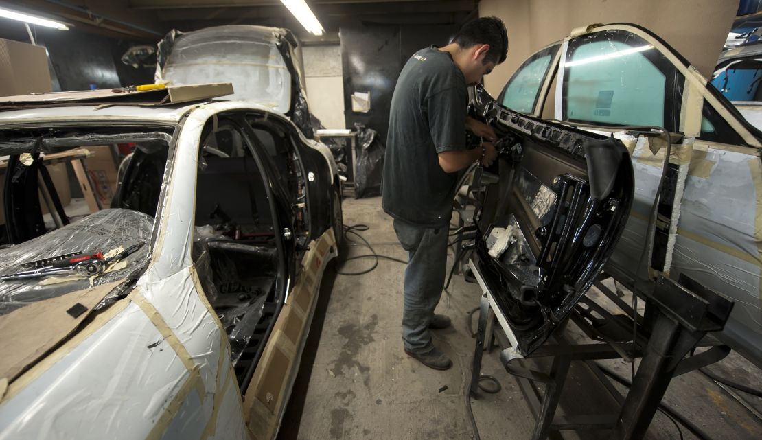 Armor plating is installed in a vehicle in Mexico City, where security businesses are booming.