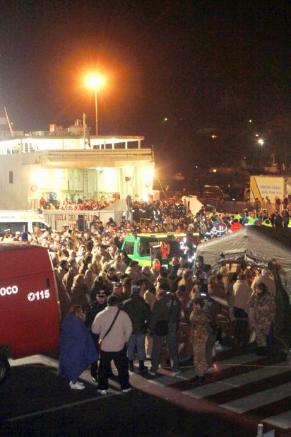 Passengers arrive on land after they were rescued. There was chaos as passengers scrambled to get off the ship.