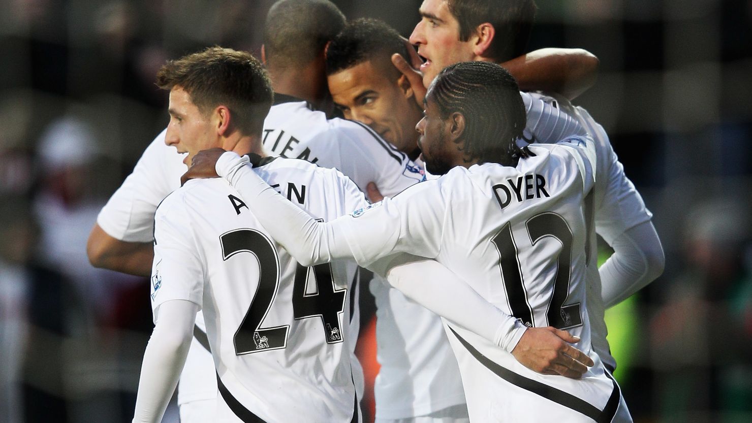 Swansea players congratulate Scott Sinclair after his equalizing goal against Arsenal.
