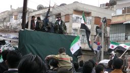 The Free Syrian Army (FSA) and their supporters gather in the Khalidiya neighborhood of the flashpoint city of Homs on January 13, 2012.
