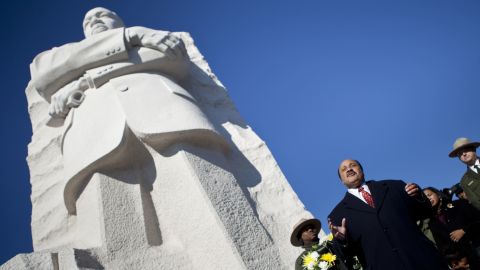 Martin Luther King III speaks at the base of a statue of his father after a wreath-laying ceremony Sunday in Washington.
