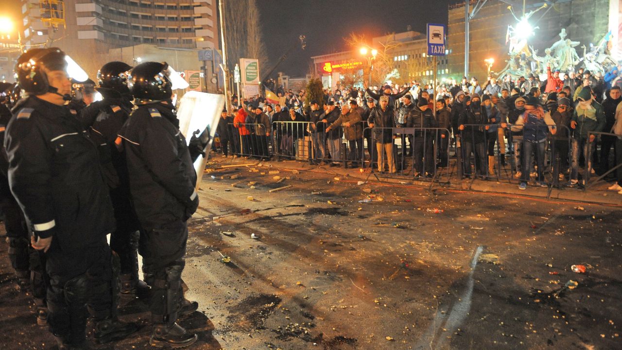 	Romanian police take position in the center of Bucharest on January 15, 2012 during a demonstration against the government's austerity program and Romanian President Traian Basescu.