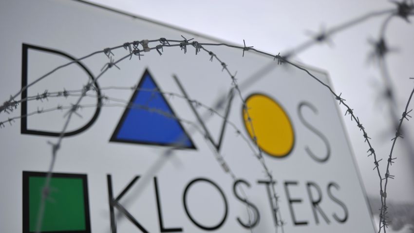A Davos sign is displayed behind barbed wire at the Swiss village's entrance on January 10, 2012.