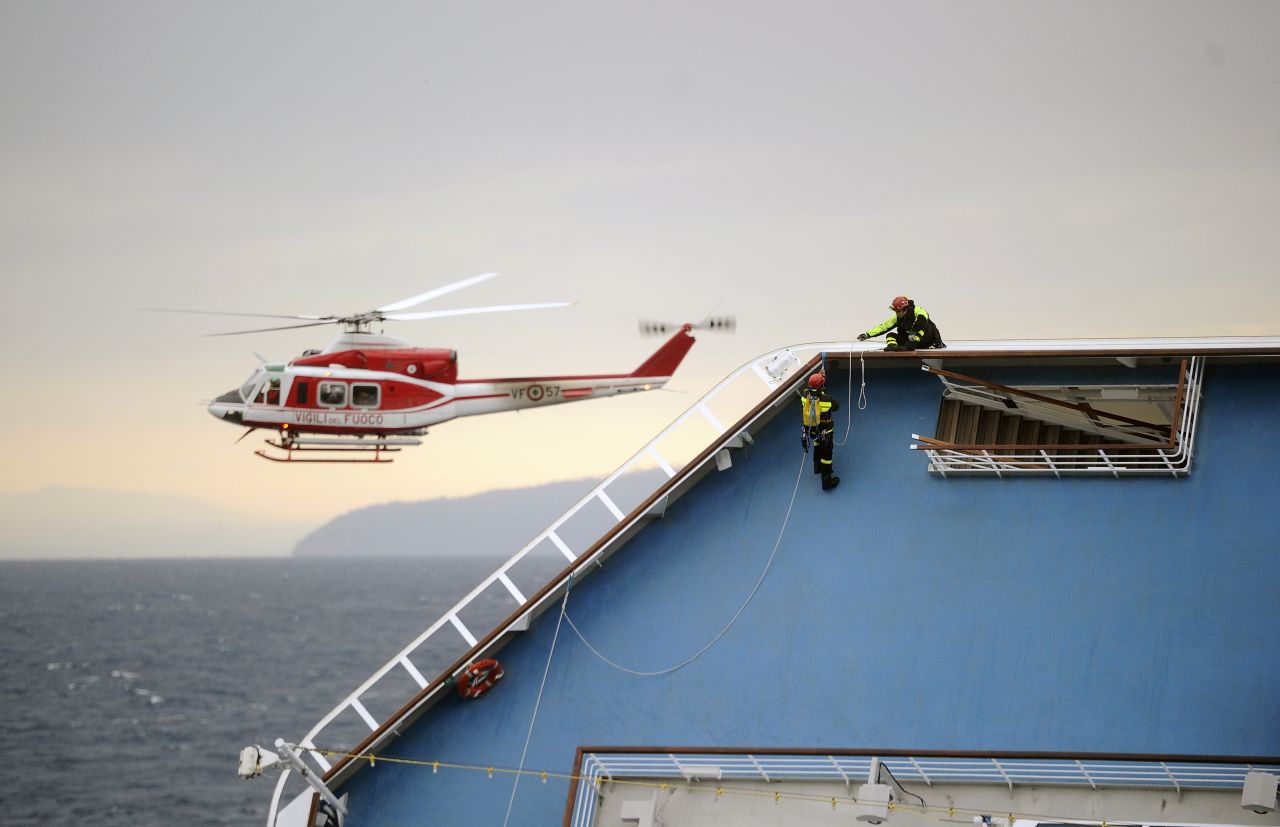 Firemen work on the Costa Concordia cruise ship on January 16. The captain may have made "significant" errors that led to wreck, the cruise line said.
