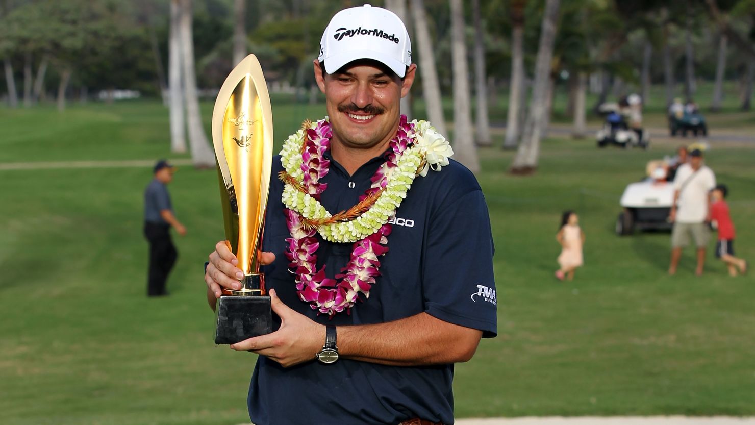 Johnson Wagner, sporting his mustache, celebrates after winning his third PGA Tour title.