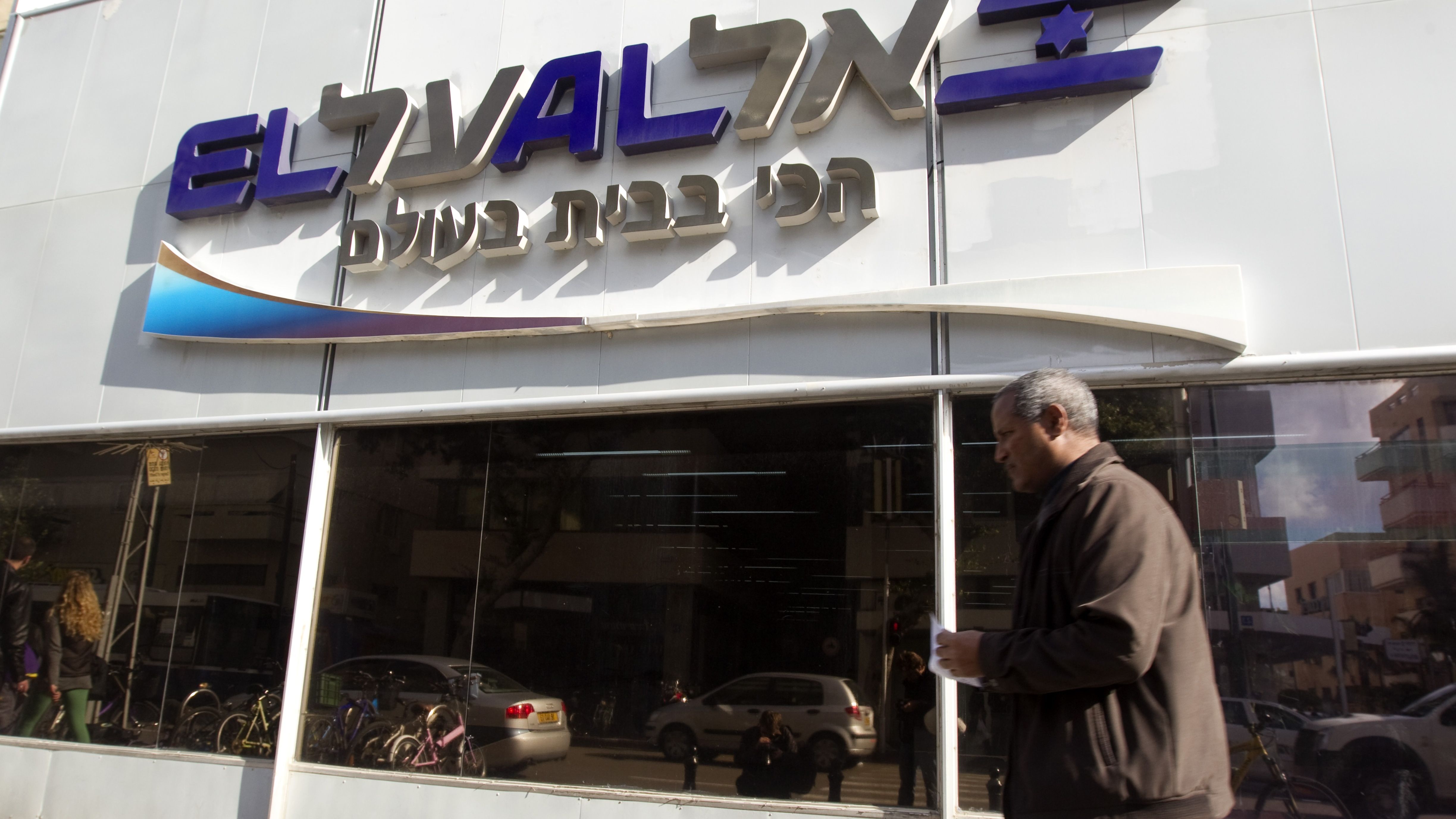 A man walks past an office of Israeli airline El Al in Tel Aviv. The airline's website was brought down by an apparent hacking attack.