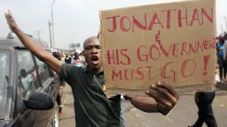 A man protesting against President Jonathan's government for scrapping oil subsidy.