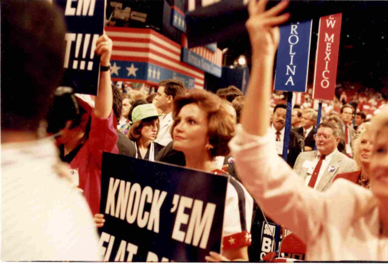 Costa holds a "Knock 'Em Flat Pat" sign during Robertson's address to the 1992 Republican National Convention in Houston.