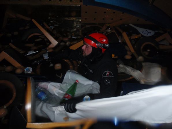 Divers have been searching the skyscraper-sized ship, working underwater in pitch blackness, in hopes of finding the missing.