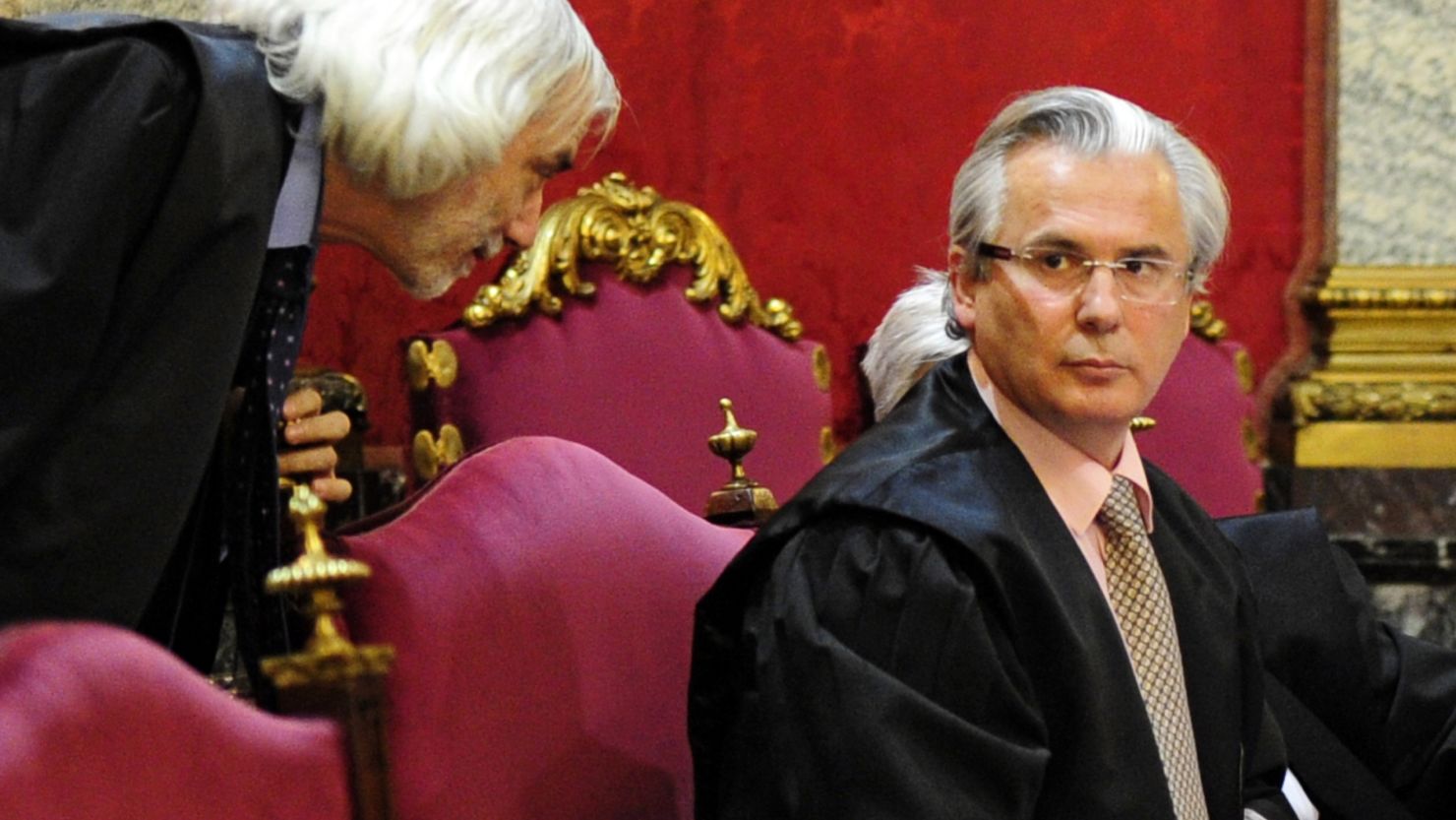 Spanish judge Baltasar Garzon (right) attends the first day of his trial on January 17, 2012.