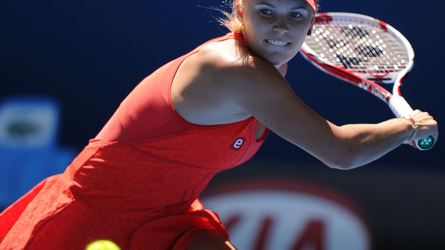 Denmark's Caroline Wozniacki hits a return against Anna Tatishvili of Georgia during their second-round encounter.
