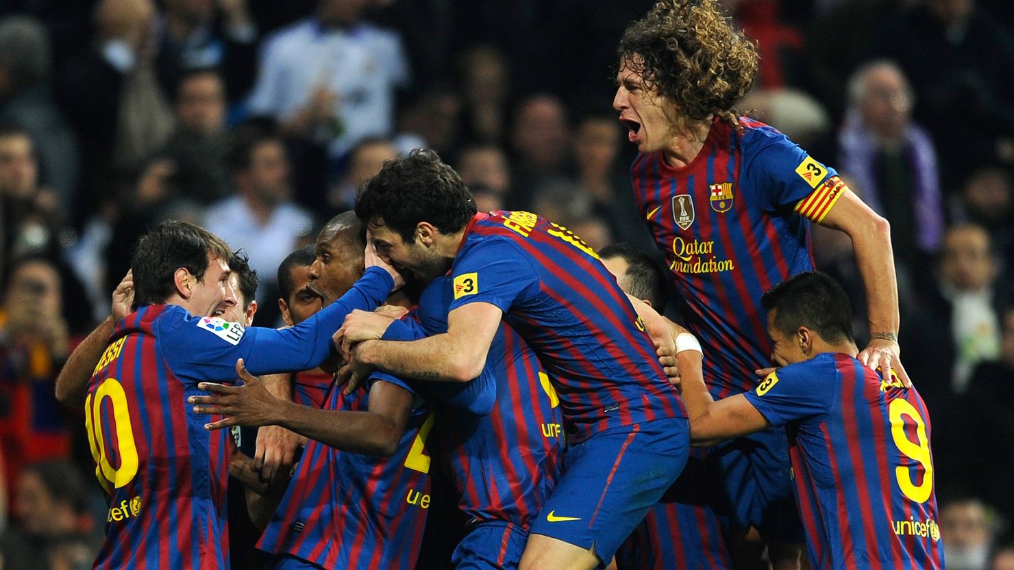 Eric Abidal celebrates after his goal secured a 2-1 victory for Barcelona over Real Madrid in the Spanish Cup.