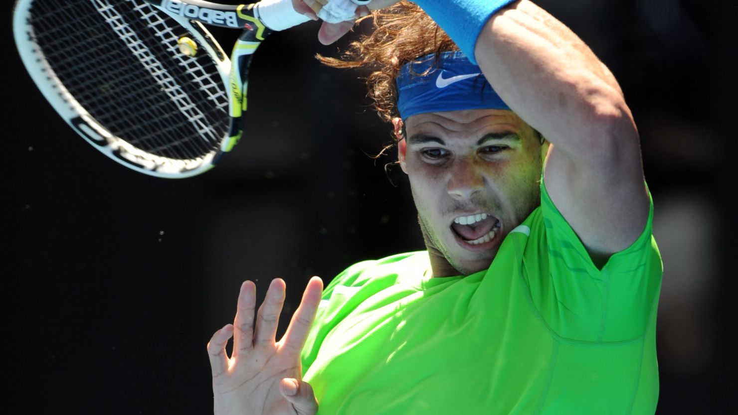 Spanish tennis star Rafael Nadal hits a return during his win against Germany's Tommy Haas.