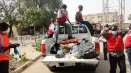 Rescue workers carry the bodies of victims killed by multiple explosions and armed assailants in the Marhaba area of the northern Nigerian city of Kano into the morgue at the Murtala Mohammed Specialist Hospital, on January 21, 2012. Coordinated bomb attacks on January 20 targeting security forces and gun battles have killed at least 121 people in Nigeria's second-largest city of Kano, with bodies littering the streets.