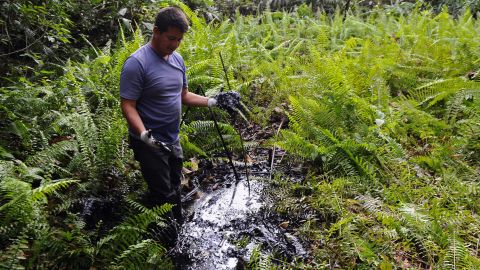 Donald Moncayo, Ecuadorean activist of the Amazonia Defense Front,  shows oil waste near La Primavera in February 2011.